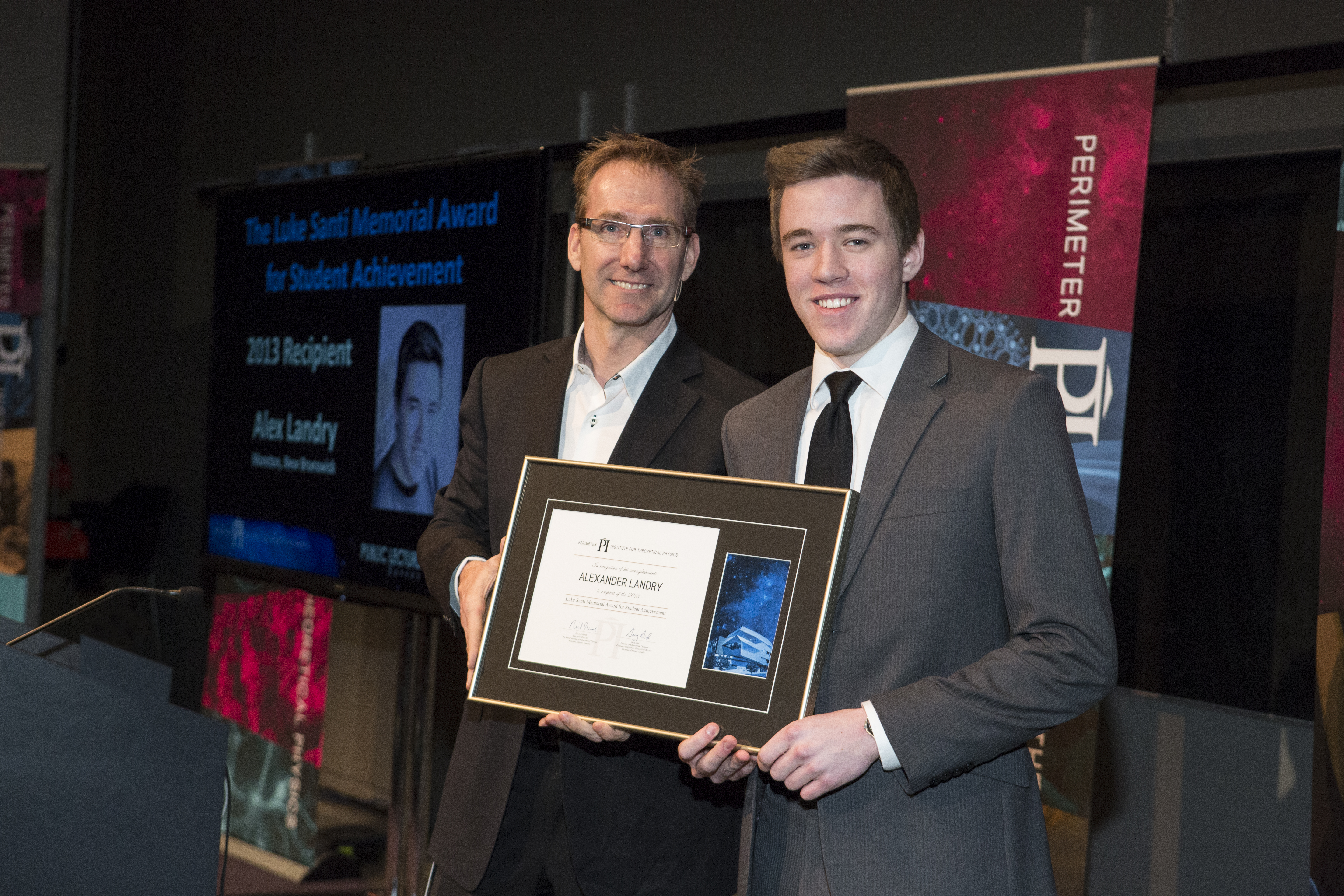 Alexander Landry receiving his award from the hands of Greg Dick 