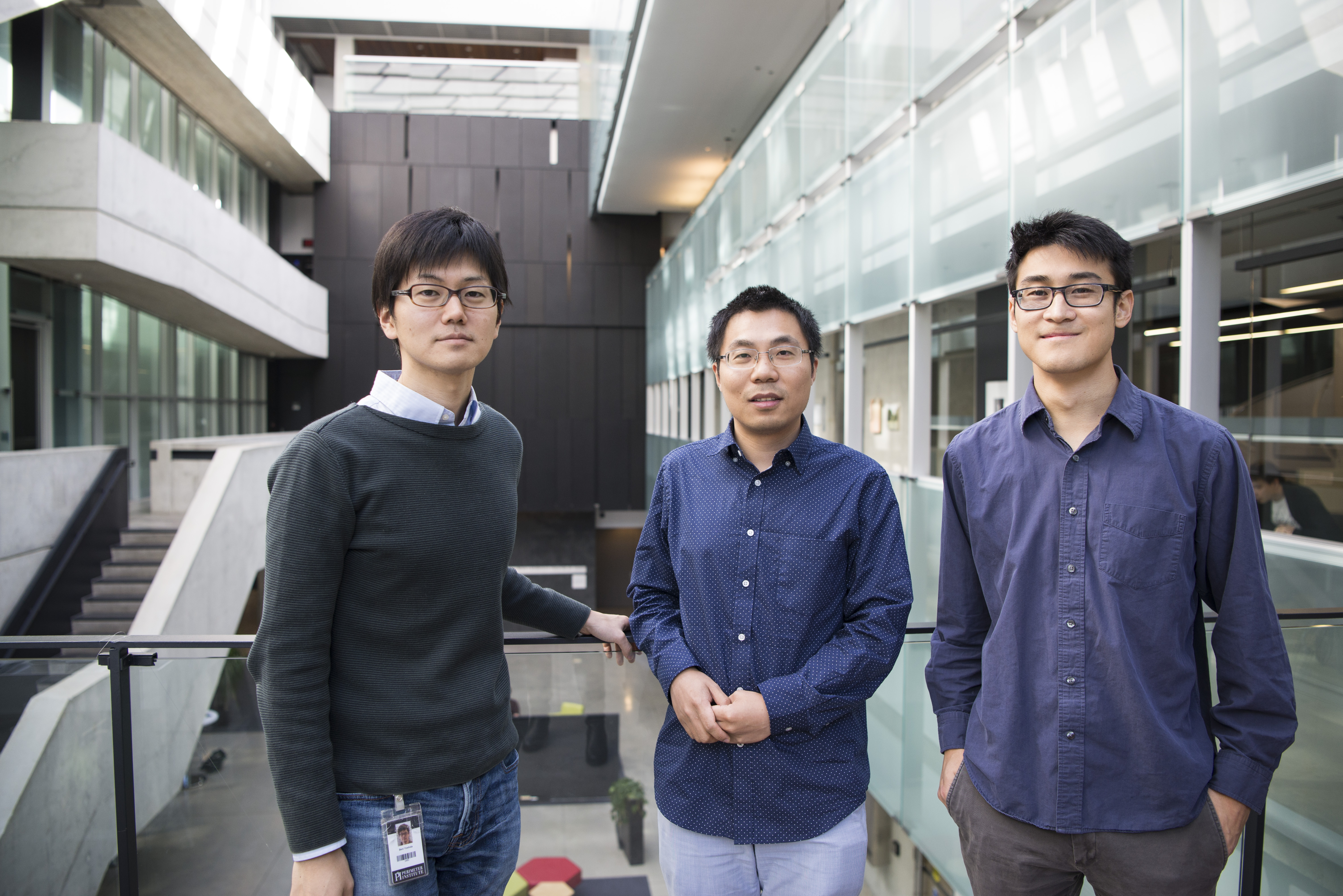 Beni Yoshida, Yin-Chen He, and Timothy Hsieh stop for a chat in the Perimeter atrium.