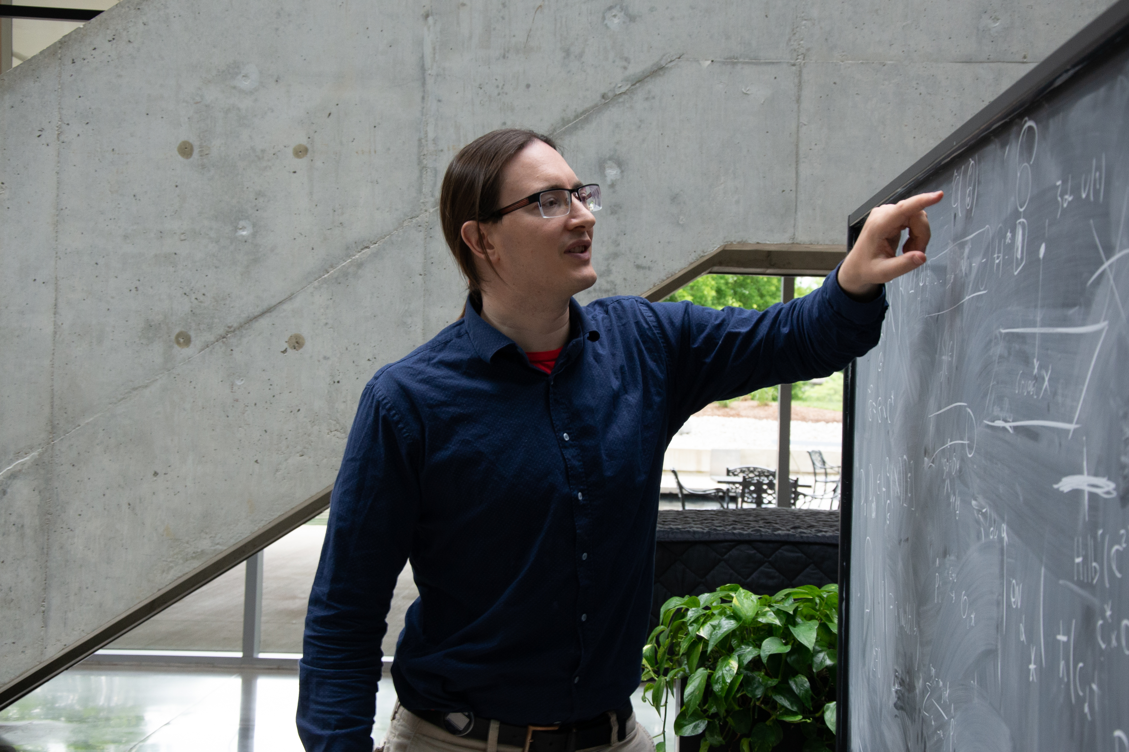 Davide Gaiotto explaining something on a chalboard