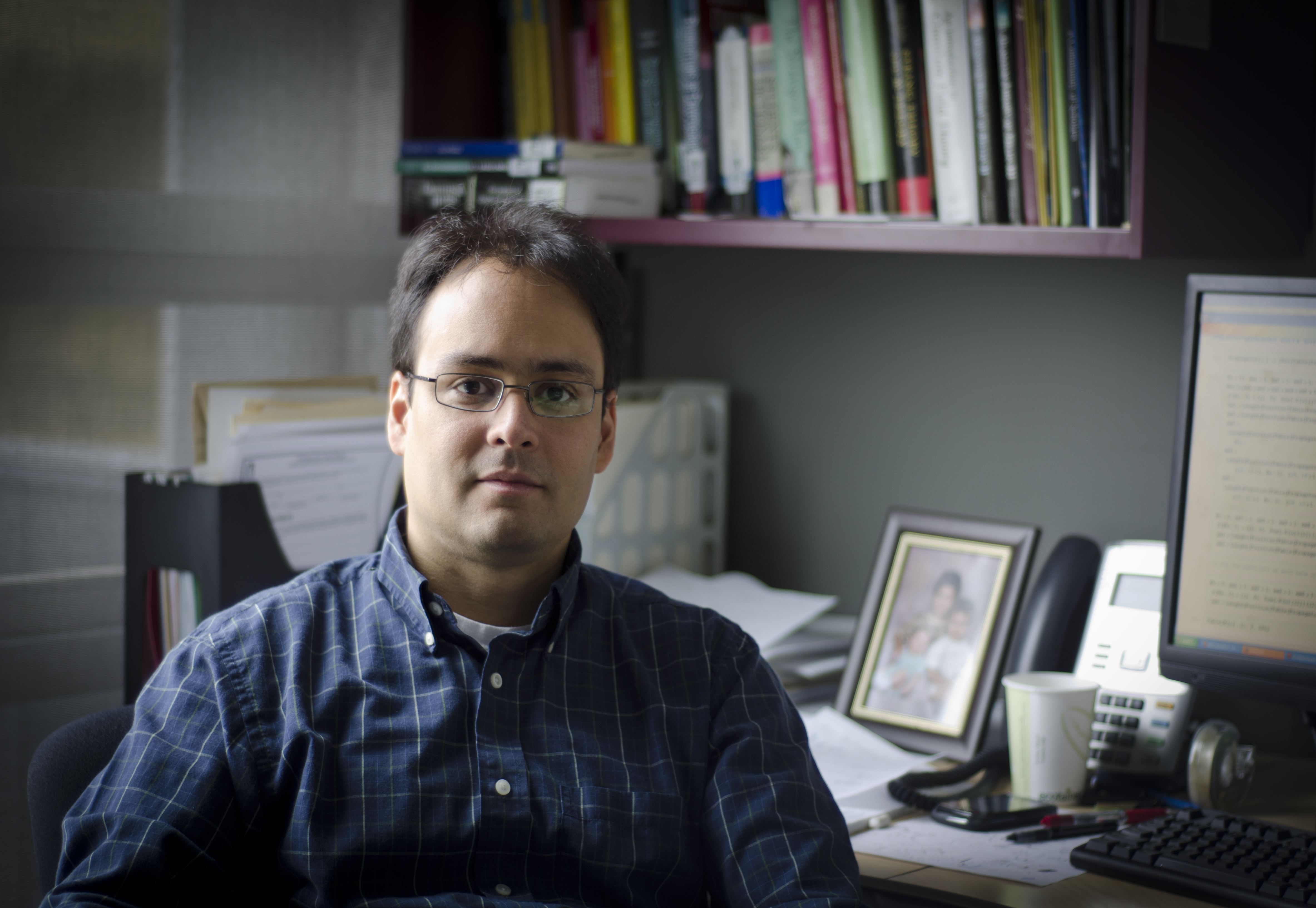 Freddy Cachazo sitting at his desk at Perimeter Institute