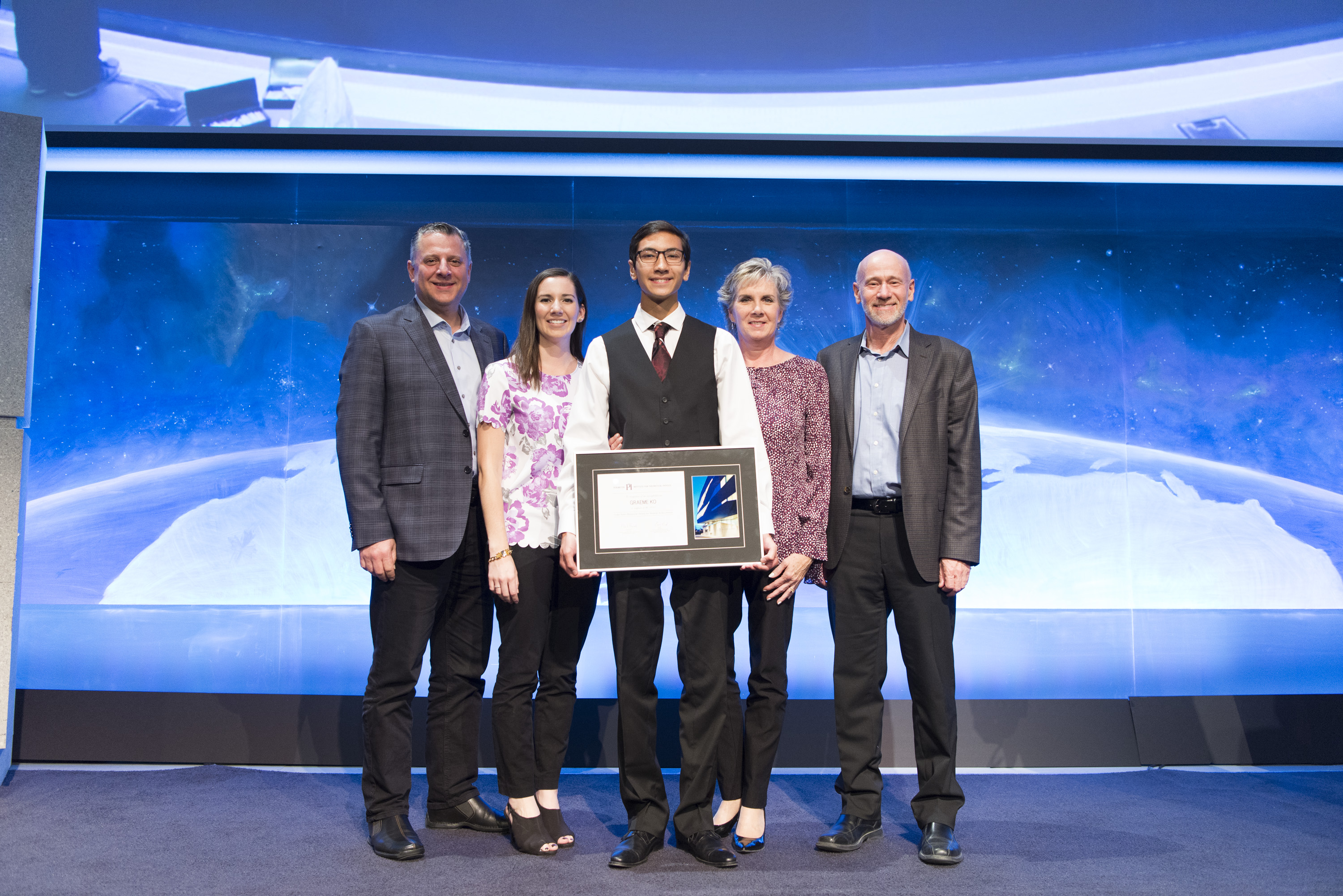 Graeme Ko posing with his award