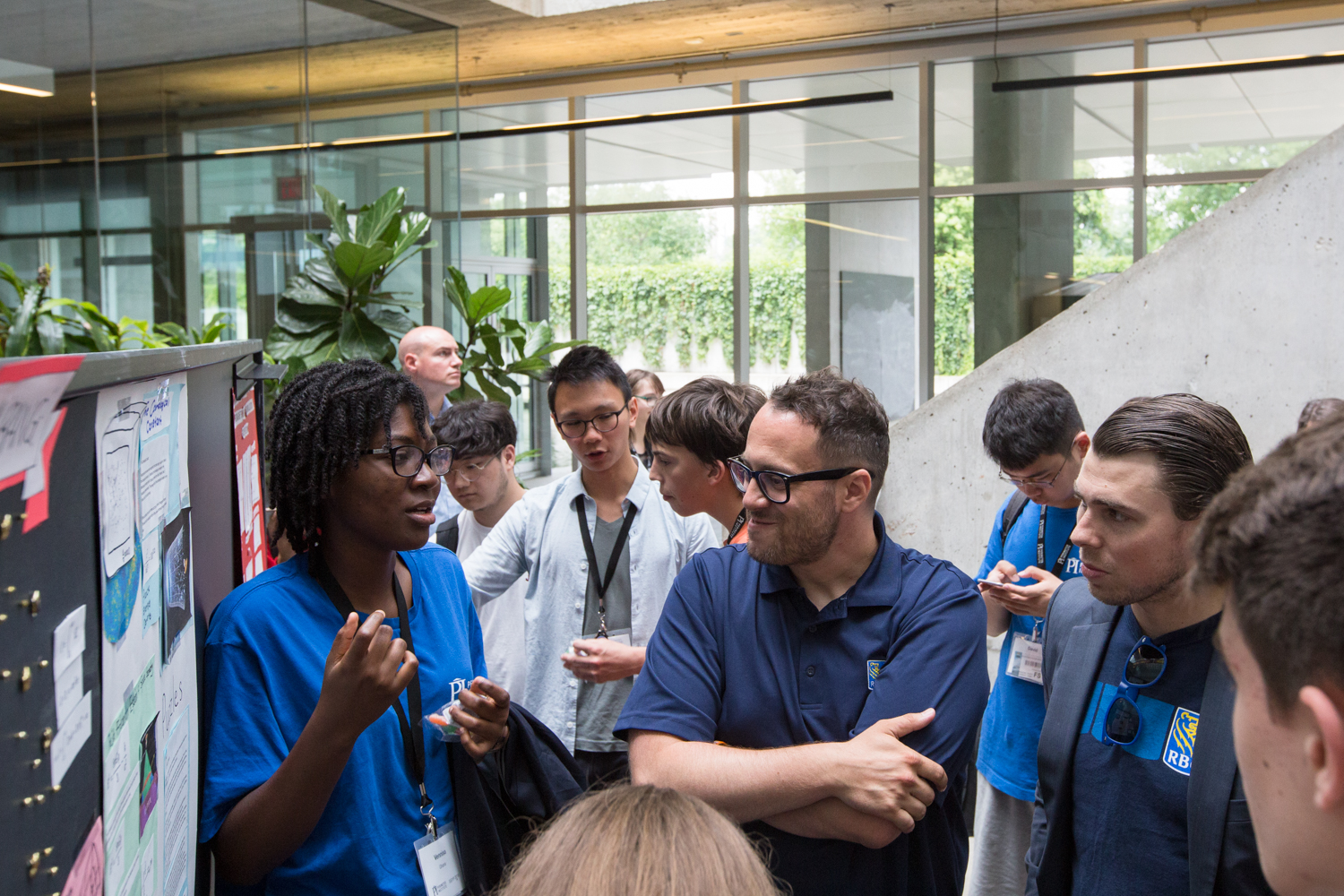 Vennisa Owusu-Barfi presenting her work to RBC Foundation representatives at the ISSYP poster session.