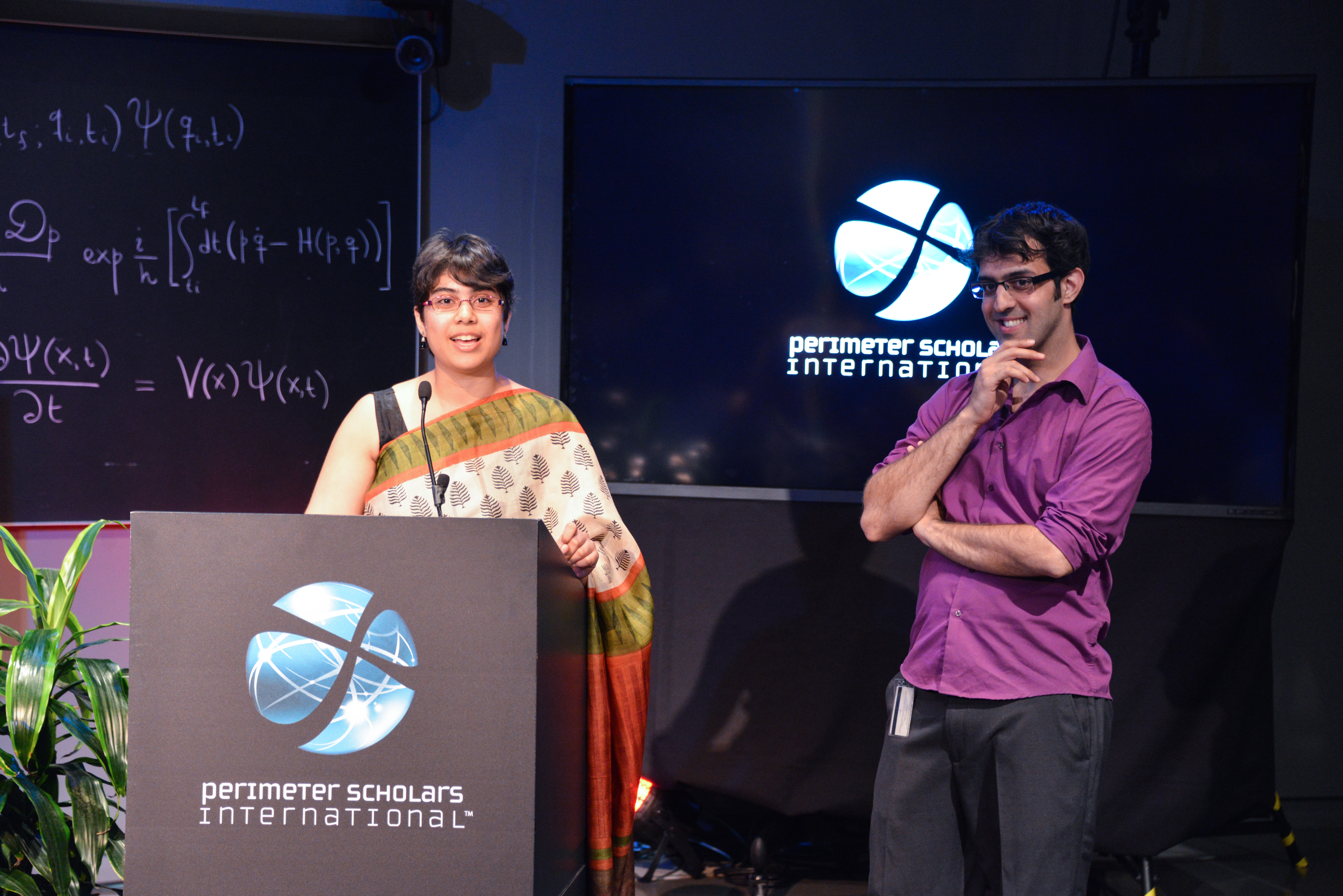 PSI 2014 valedictorians Neha Wadia and Nima Afkhami-Jeddi speaking at the graduation ceremony