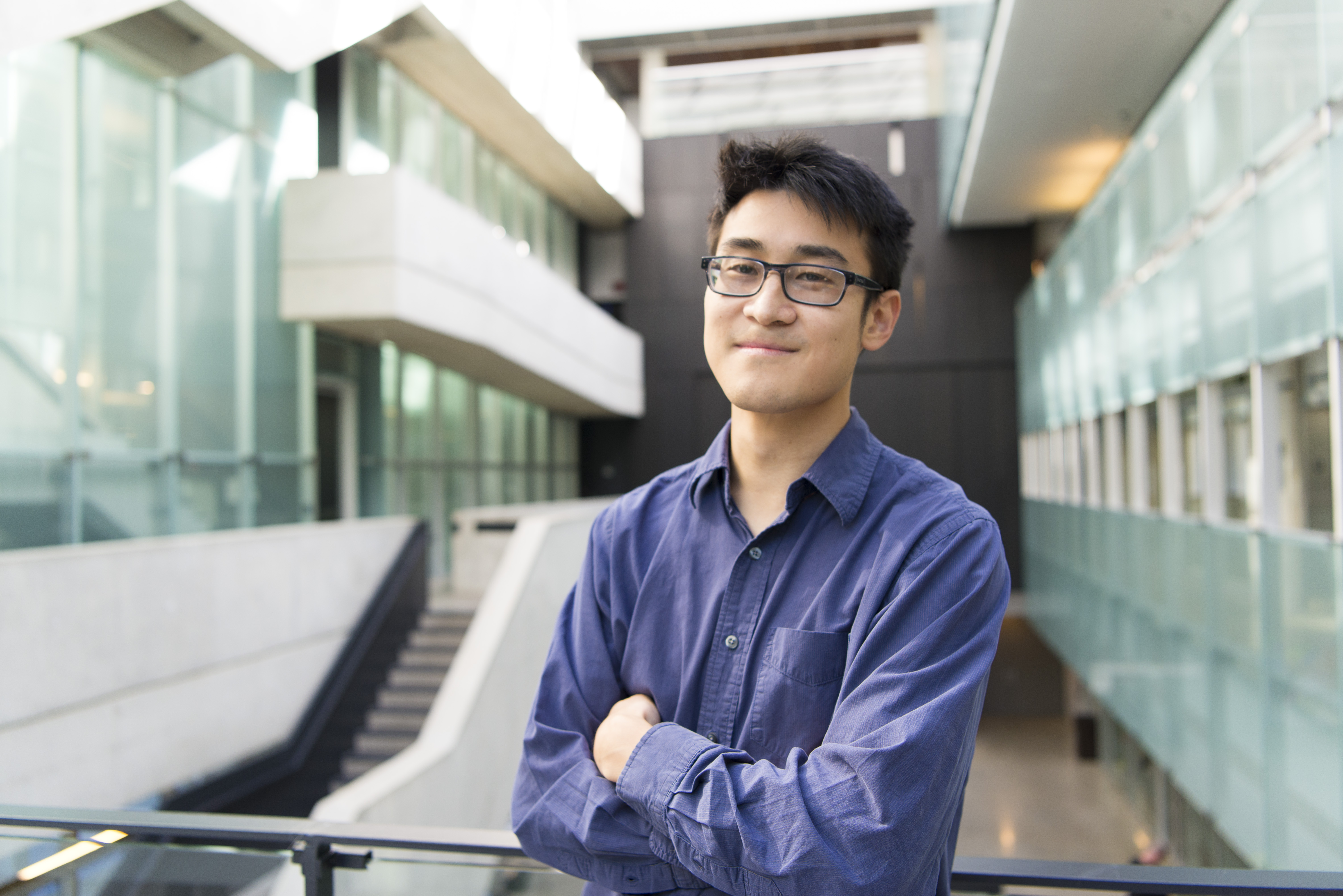 Portrait of Timothy Hsieh in front of Perimeter Institute's atrium