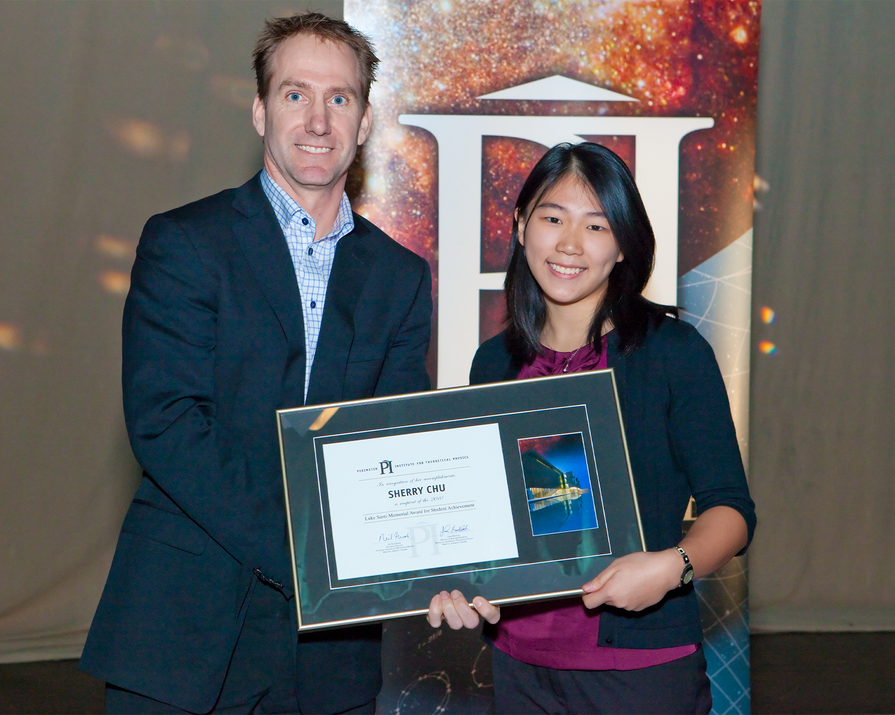 Sherry Chu receiving her Luke Santi Memorial award from Greg Dick, Perimeter's General Manager