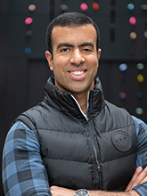 Portrait of a man standing in an atrium