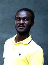 Portrait of a man wearing a yellow polo shirt