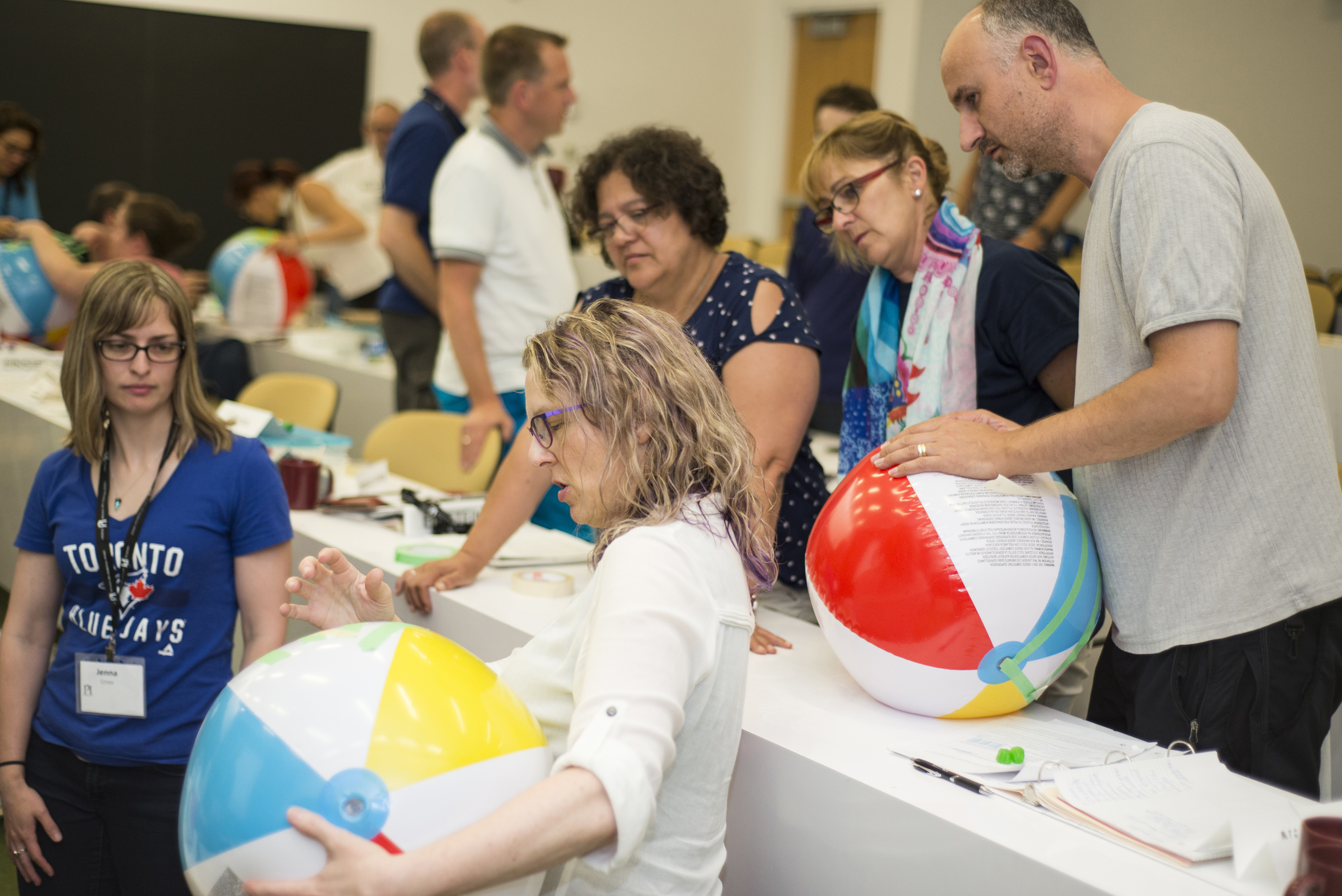 Group of teachers working together on a science demo