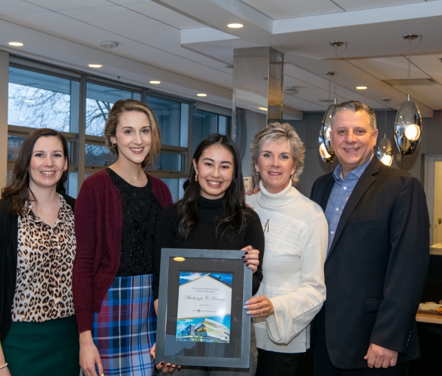 Mackenzie Pereira, recipient of the 2019 Luke Santi award, and the Santi family