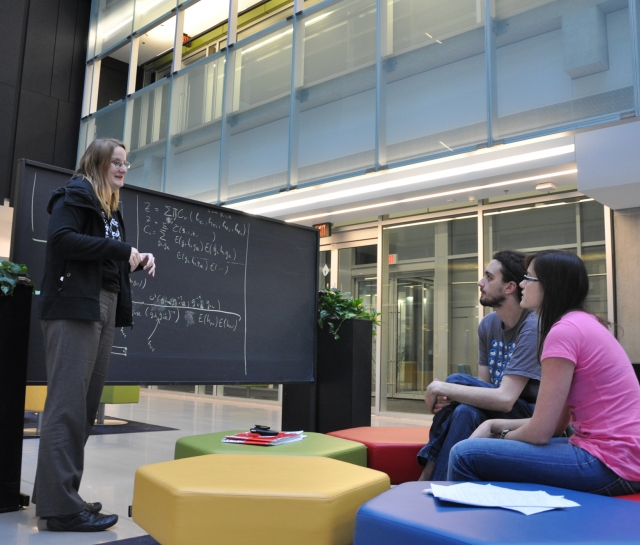 Bianca Dittrich talking to another man and women in atrium