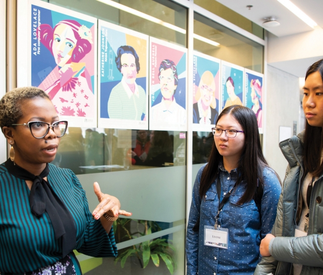 Woman talking to group of highschool girls