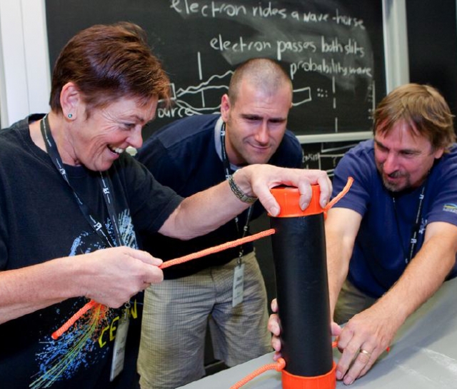 Three teachers working on an experiment together