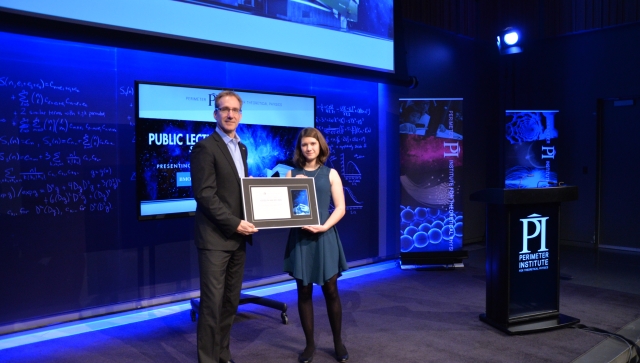 Joscelyn van der Veen receiving the Luke Santi Award from Director of Educational Outreach Greg Dick.