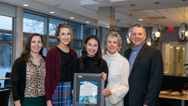 Mackenzie Pereira, recipient of the 2019 Luke Santi award, and the Santi family