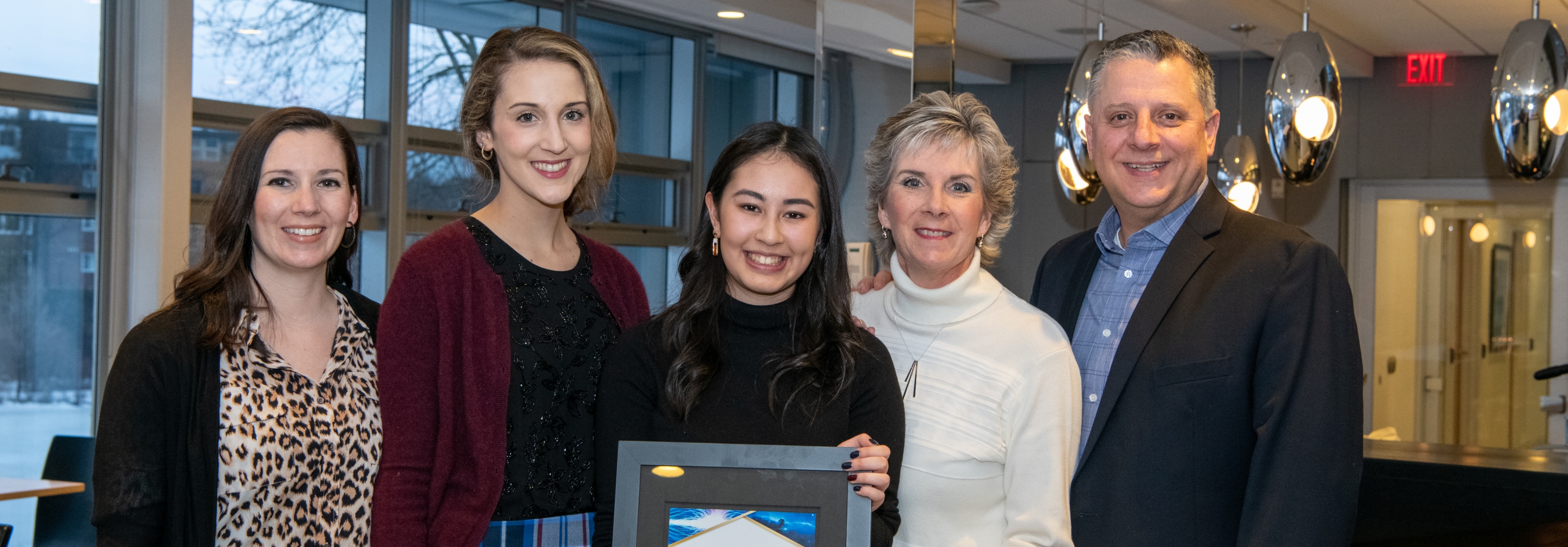 Mackenzie Pereira, recipient of the 2019 Luke Santi award, and the Santi family