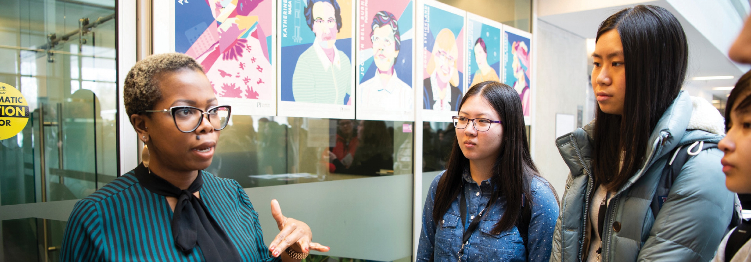 Woman talking to group of highschool girls