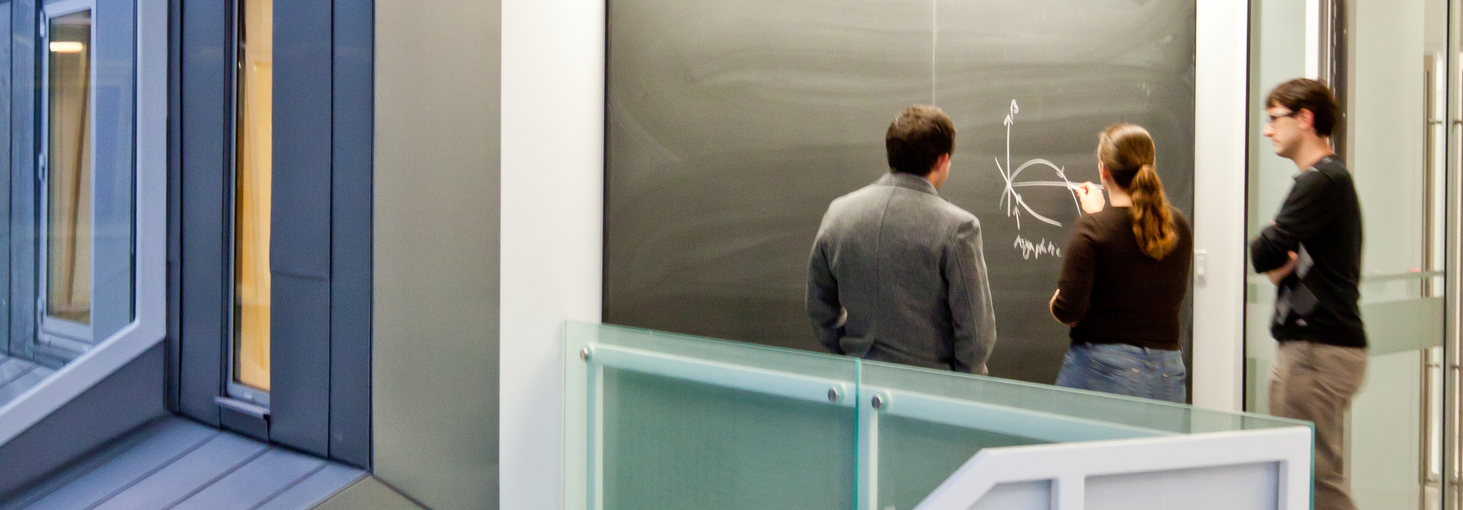 Researchers interacting in the perimeter institute building