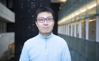 Portrait of Chong Wang in Perimeter Institute's Atrium