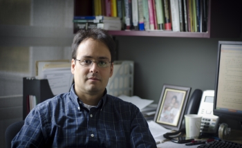 Freddy Cachazo sitting at his desk at Perimeter Institute