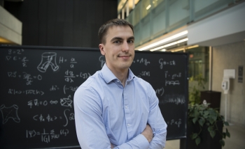 Portrait of William East in the Atrium at Perimeter Institute