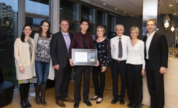 The Santi and Richards families celebrating with Aidan Richards  as he receives the Luke Santi Award. 