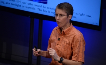 Woman speaking on stage 