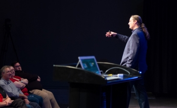 Man speaking on stage 