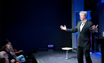 Man speaking on stage 