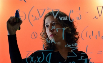 Woman writing on glass