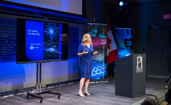 Woman speaking on stage 