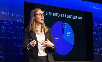 Woman speaking on stage 