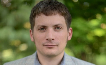 Portrait of man in front of greenery