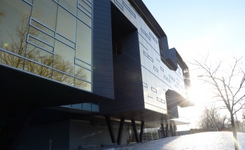 Side shot of building in the winter with sun glare