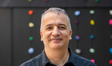 Portrait of a man standing in an atrium