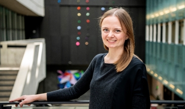 Photo of woman smiling in a large atrium