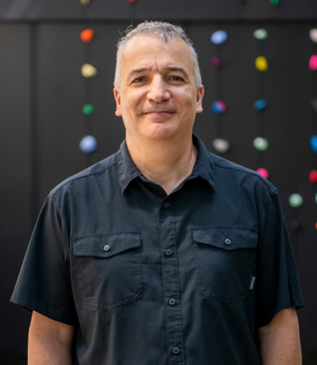 Portrait of a man standing in an atrium